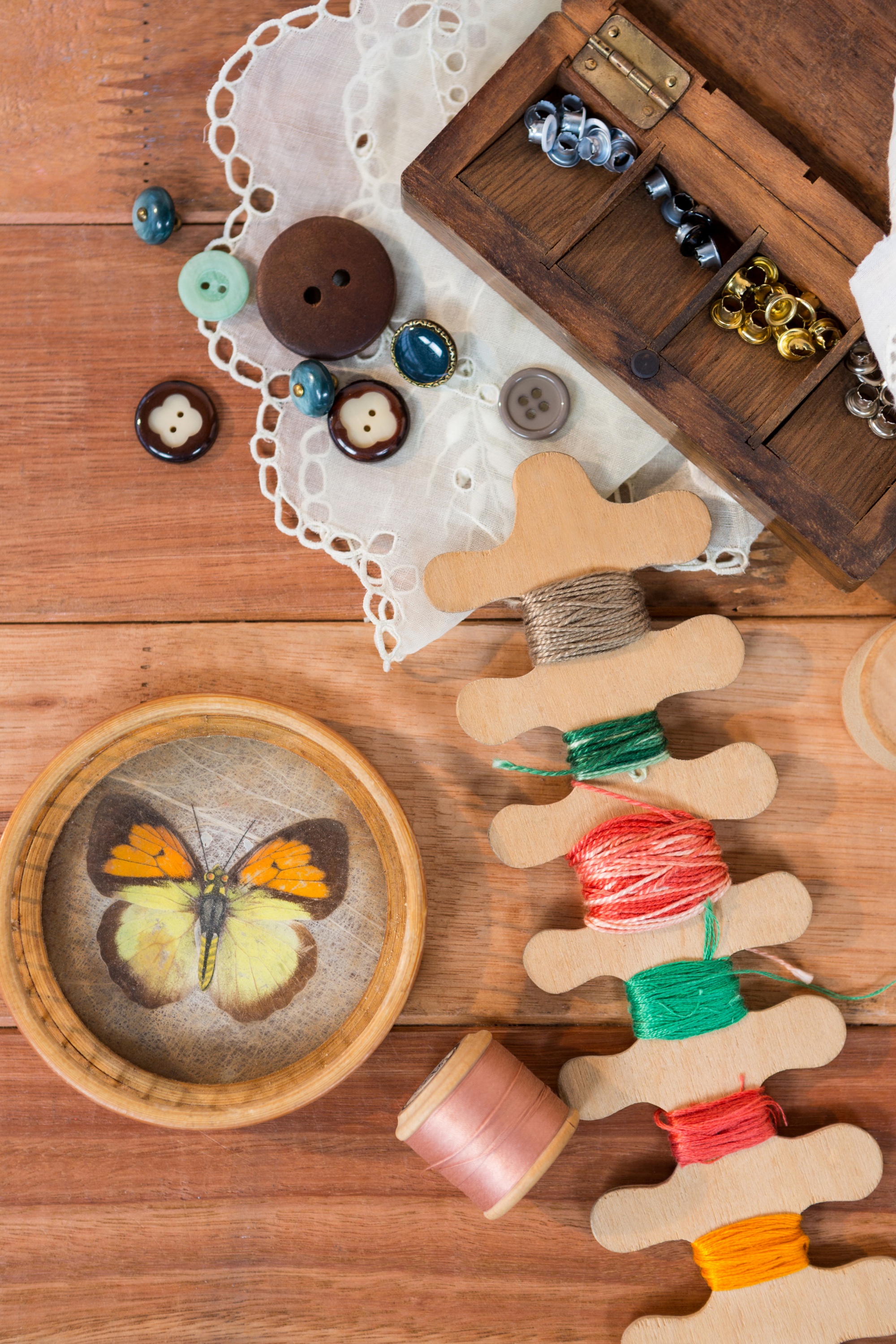 selection of embroidered goods arranged on wooden table